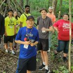 group of BELONG attendees in the woods
