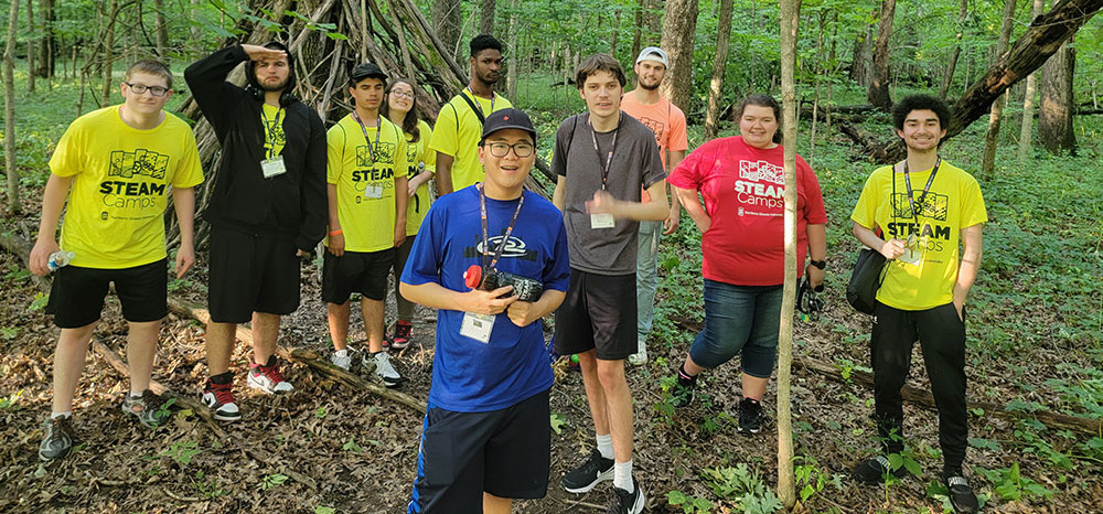 group of BELONG attendees in the woods
