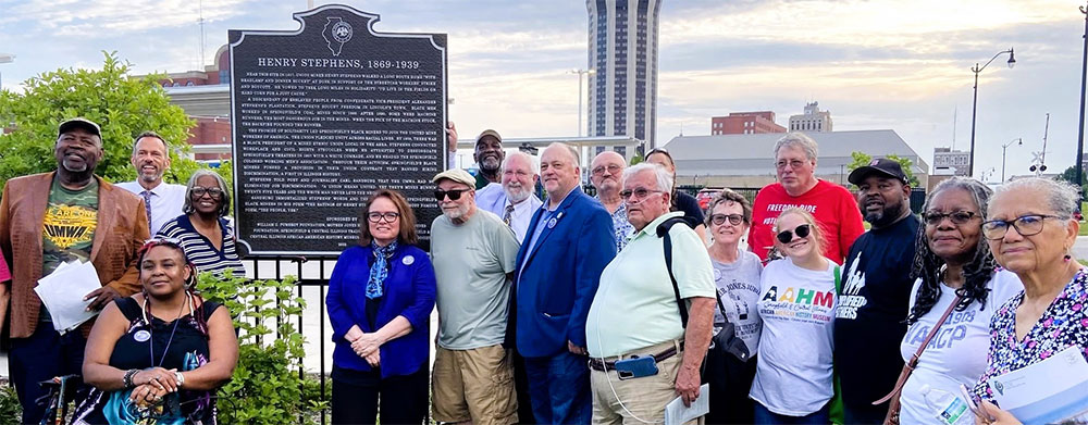 community group poses in front of the Henry Stephens Historical Marker