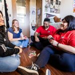 students playing Uno on a dorm room floor