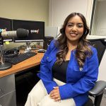 Lidia Marquez sits at her desk