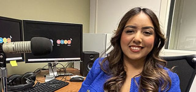 Lidia Marquez sits at her desk